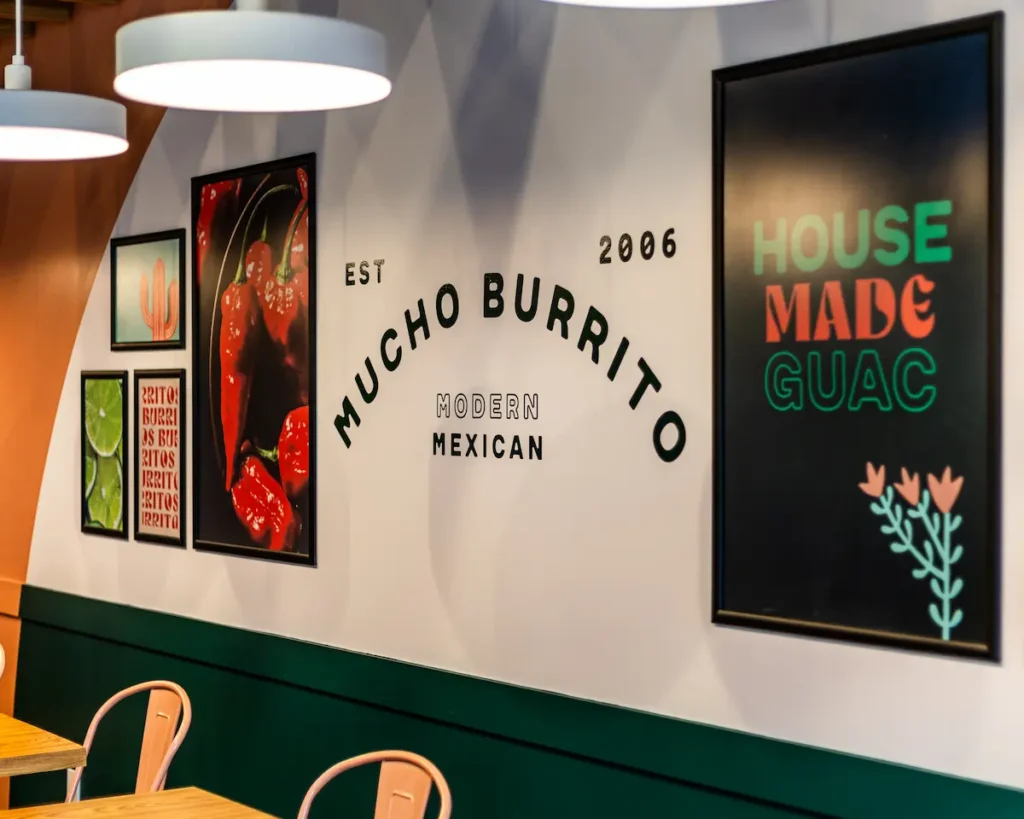 Mucho Burrito fast-casual franchise interior showcasing vibrant décor.